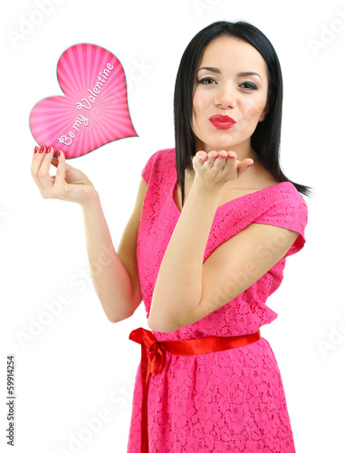 Photo: Attractive young woman with Valentine card isolated on white Attractive young woman with Valentine card isolated on white