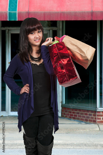 Photo: Hispanic Woman with Shopping Bags Hispanic Woman with Shopping Bags