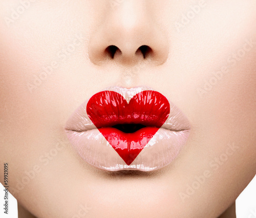 Photo: Beauty Sexy Lips with Heart Shape paint. Valentines Day Beauty Sexy Lips with Heart Shape paint. Valentines Day