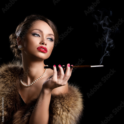 Photo: Vintage, retro. Beautiful, attractive woman wearing fur Vintage, retro. Beautiful, attractive woman wearing fur