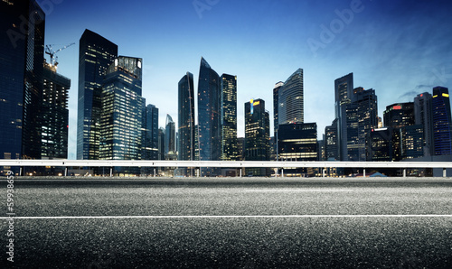 Photo: Asphalt road and modern city Asphalt road and modern city