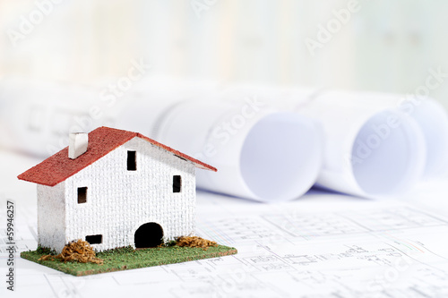 Photo: Toy house with house plans. Toy house with house plans.