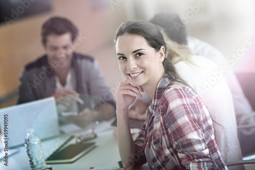 Photo: Cheerful young woman at university Cheerful young woman at university