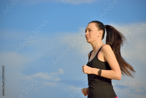 Photo: Woman jogging outdoors Woman jogging outdoors