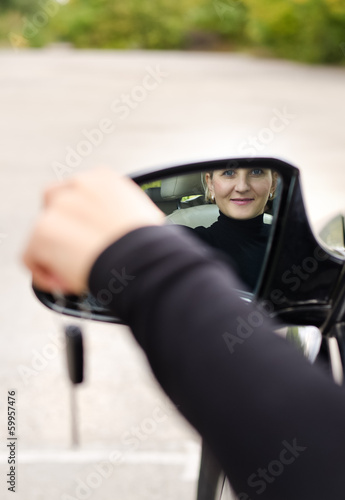 Photo: Attractive woman driver with her car keys Attractive woman driver with her car keys