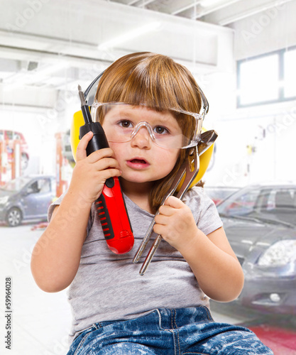 Photo: baby girl with working tool baby girl with working tool