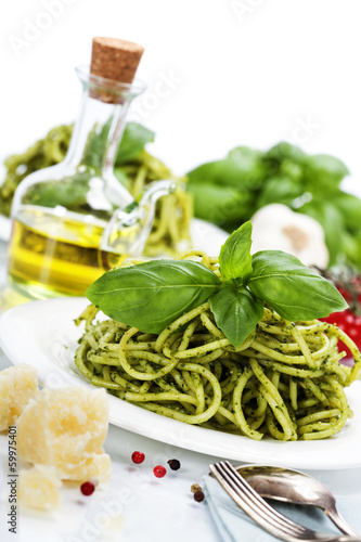 Photo: delicious italian pasta with pesto sauce delicious italian pasta with pesto sauce