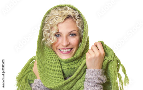 Photo: Portrait of a smiling woman wrapped with wool scarf Portrait of a smiling woman wrapped with wool scarf