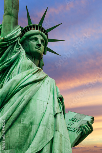 Photo: Statue of Liberty under colorful sky Statue of Liberty under colorful sky