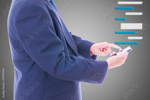 Photo: business man holding smart phone with chat balloon business man holding smart phone with chat balloon