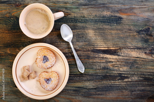Photo: Coffee and cookies in the shape of heart. Coffee and cookies in the shape of heart.