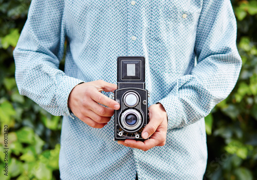 Photo: Hands taking photo with TLR camera Hands taking photo with TLR camera