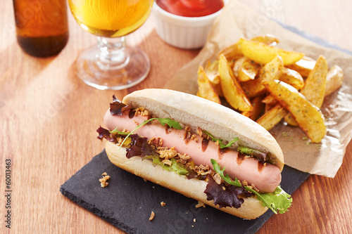 Photo: Gourmet hot dog on slate board Gourmet hot dog on slate board