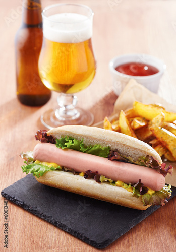 Photo: Gourmet hot dog on slate board Gourmet hot dog on slate board