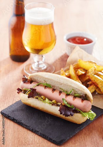 Photo: Gourmet hot dog on slate board Gourmet hot dog on slate board