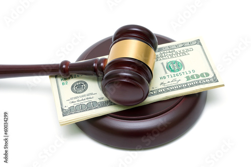 Photo: gavel and money closeup gavel and money closeup