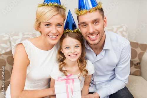 Photo: happy family with gift box happy family with gift box