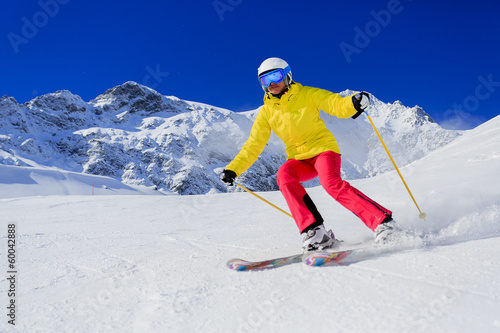 Photo: Skiing, skier, winter sport - woman skiing downhill Skiing, skier, winter sport - woman skiing downhill