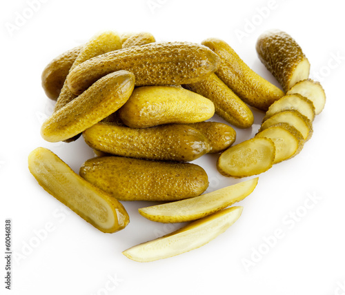 Photo: pickled cucumbers. Gherkins on a white background pickled cucumbers. Gherkins on a white background
