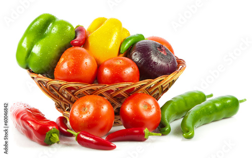 Photo: Fresh vegetables in basket isolated on white. Bio Vegetable. Co Fresh vegetables in basket isolated on white. Bio Vegetable. Co