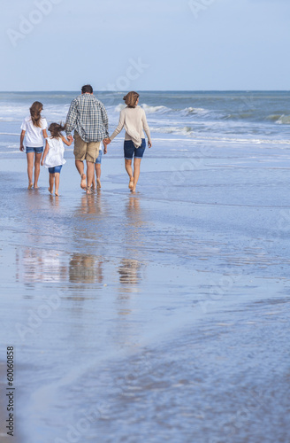 Photo: Family Parents Girl Children Walking on Beach Family Parents Girl Children Walking on Beach