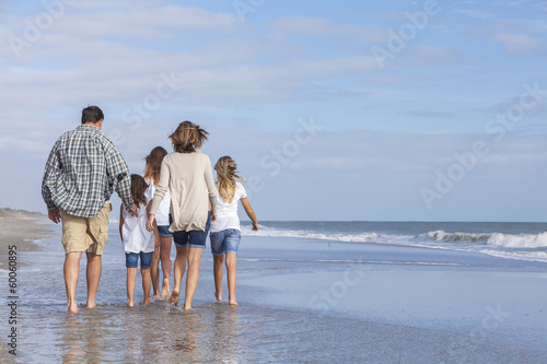 Photo: Family Parents Girl Children Walking on Beach Family Parents Girl Children Walking on Beach