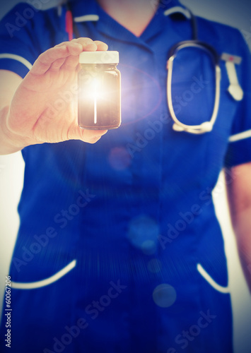 Photo: nurse holding pill jar nurse holding pill jar