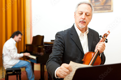 Photo: Violinst and pianist playing together Violinst and pianist playing together