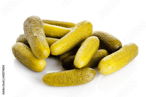 Photo: pickled cucumbers. Gherkins on a white background pickled cucumbers. Gherkins on a white background