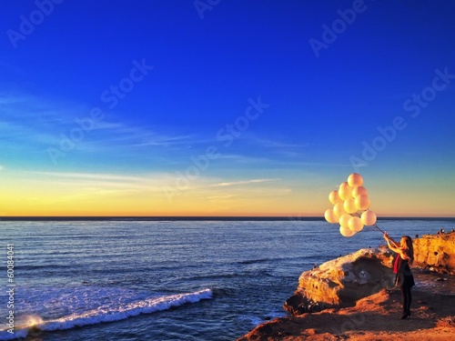 Instant Collection: Woman with Balloons at Sunset Cliffs Point Loma California USA Woman with Balloons at Sunset Cliffs Point Loma California USA