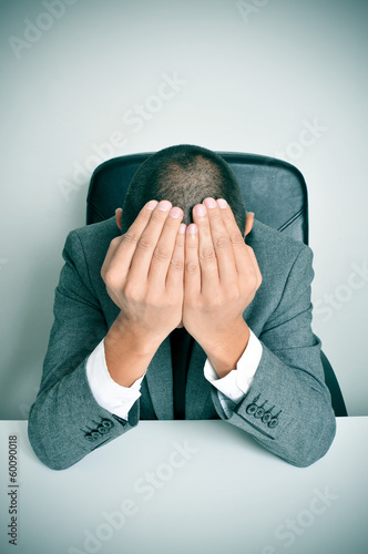 Photo: businessman with his hands in his head businessman with his hands in his head