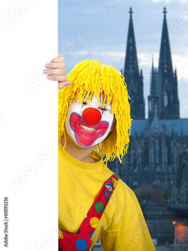 Photo: Clown mit Schild in Köln Clown mit Schild in Köln