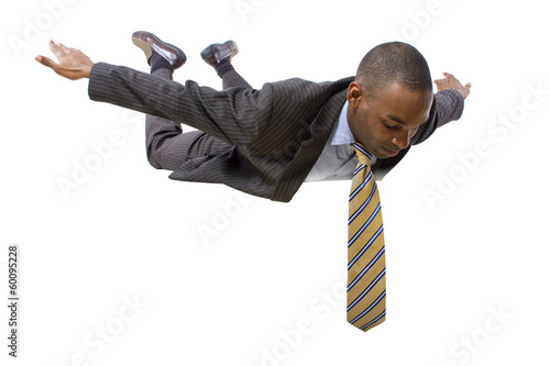 Photo: young african american businessman flying or skydiving young african american businessman flying or skydiving