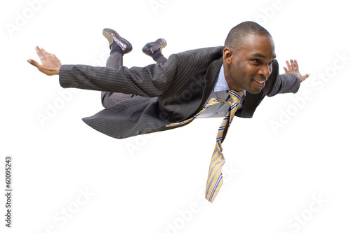 Photo: young african american businessman flying or skydiving young african american businessman flying or skydiving
