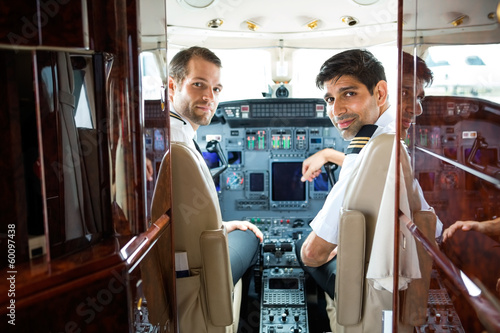 Photo: Pilots In Corporate Plane Cockpit Pilots In Corporate Plane Cockpit