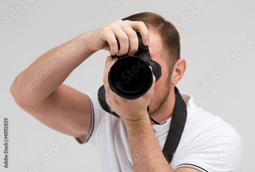 Photo: male photographer taking picture with camera male photographer taking picture with camera