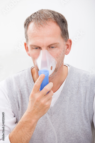 Photo: Man Doing Inhalation Man Doing Inhalation