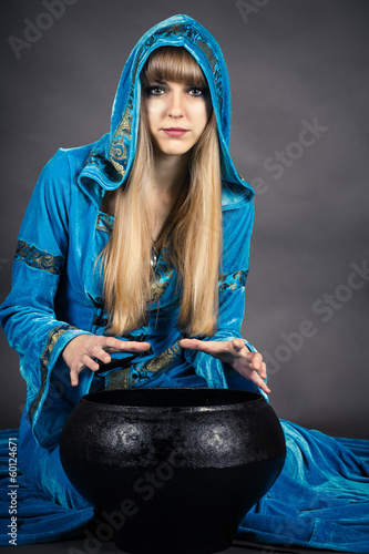 Photo: witch with cauldron isolated on gray background witch with cauldron isolated on gray background