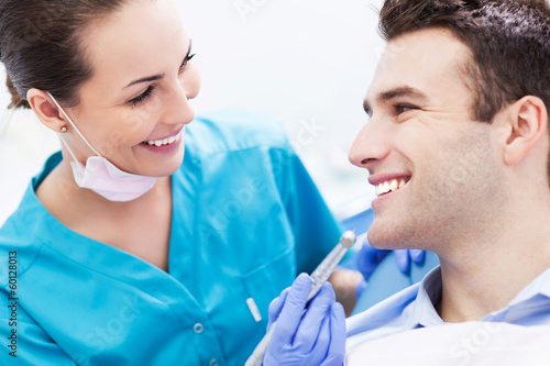 Photo: Female dentist with male patient Female dentist with male patient