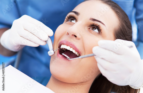 Photo: Woman having teeth examined at dentists Woman having teeth examined at dentists