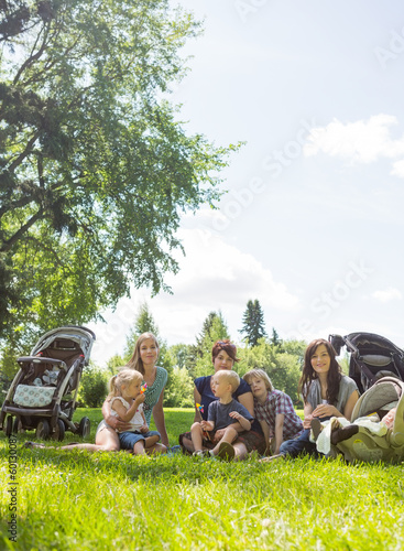 Photo: Female Friends With Their Children Enjoying Picnic Female Friends With Their Children Enjoying Picnic