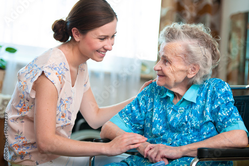 Photo: senior woman with her home caregiver senior woman with her home caregiver
