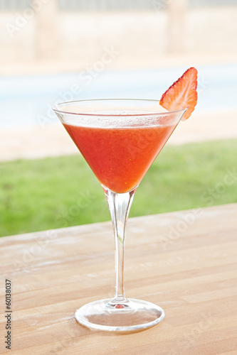Photo: Strawberry daiquiri cocktail by a pool outdoors Strawberry daiquiri cocktail by a pool outdoors
