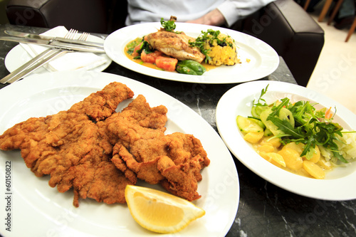 Photo: Viennese schnitzel with it's potato salad Viennese schnitzel with it's potato salad