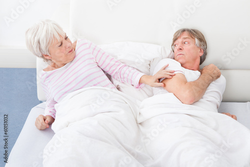 Photo: Angry Couple Lying On Bed Angry Couple Lying On Bed