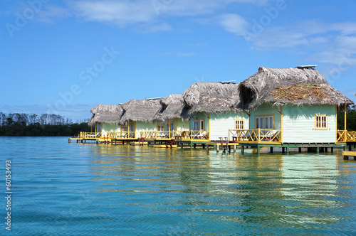 Photo: Thatched cabins over the sea Thatched cabins over the sea