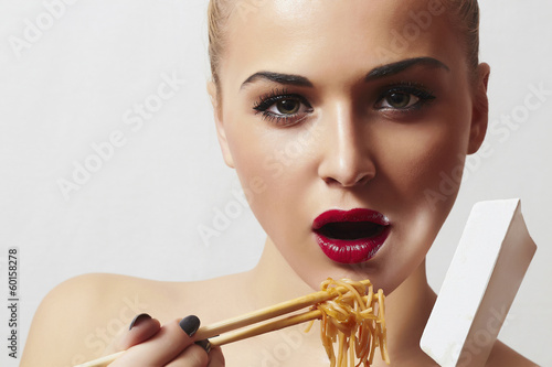 Photo: Beautiful Woman are Eating Noodles.Food.Enjoy meal Beautiful Woman are Eating Noodles.Food.Enjoy meal
