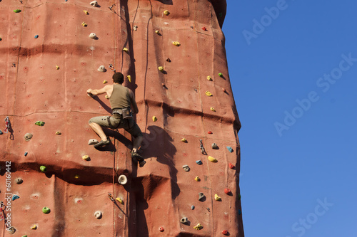 Photo: Climber in a rock wall. Climber in a rock wall.