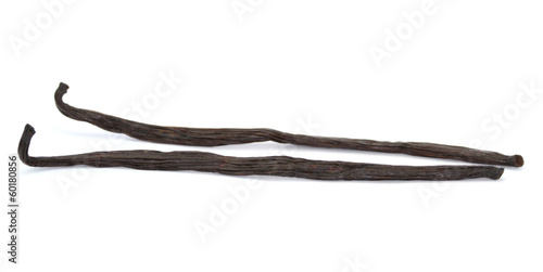Photo: Vanilla sticks isolated on white background. Vanilla sticks isolated on white background.