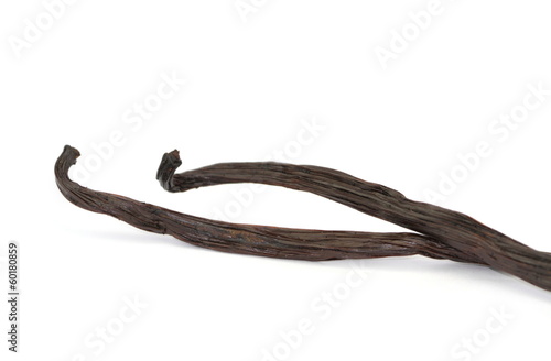 Photo: Vanilla sticks on white background Vanilla sticks on white background